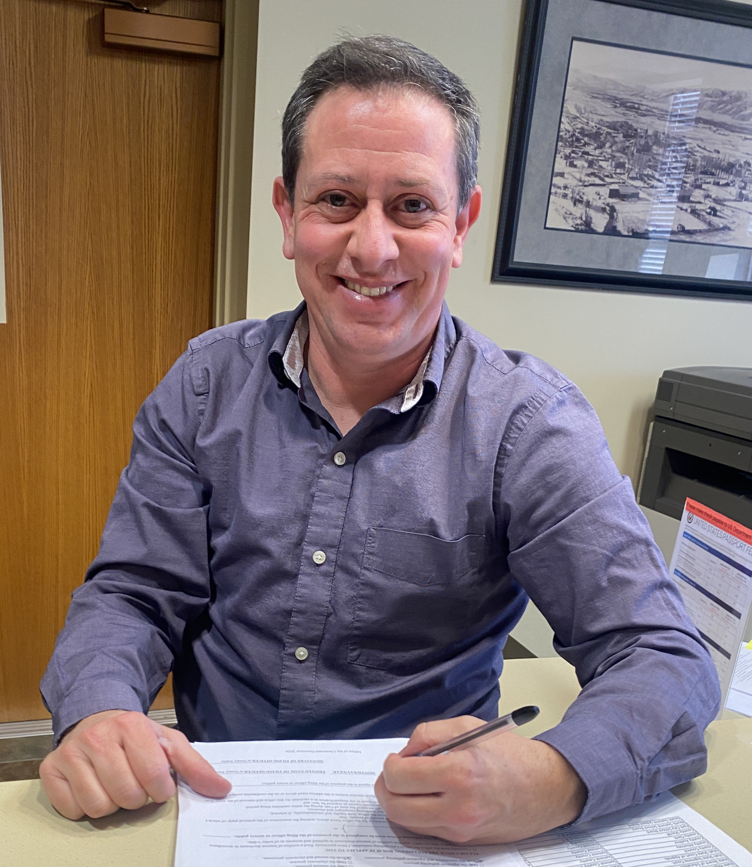 Kris Campbell signs his Declaration of Candidacy form at the Summit County Courthouse